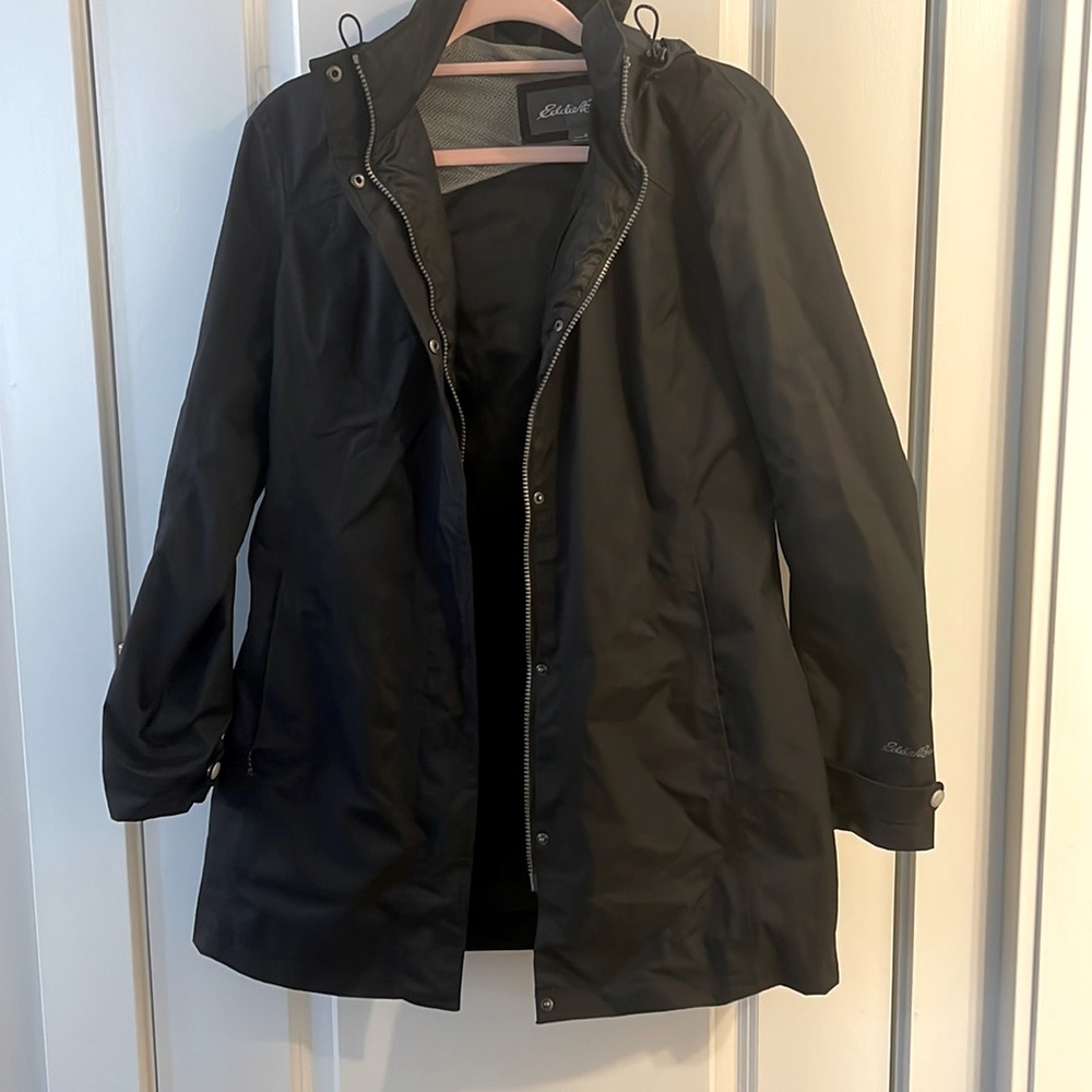 Eddie Bauer black rain jacket with hood. Smoke free home.
